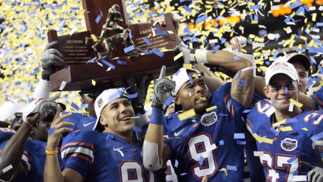 Aaron Hernandez celebrated with his University of Florida teammates after they won the Southeastern Conference Championship trophy in 2008.