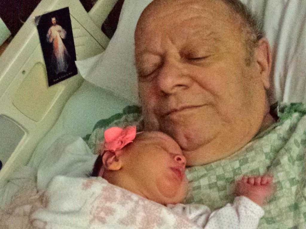 At Catholic Medical Center, Frank Pellegrino received comfort holding his first great-grandchild. By the time he left the hospital, Pellegrino had lost his leg above the knee.
