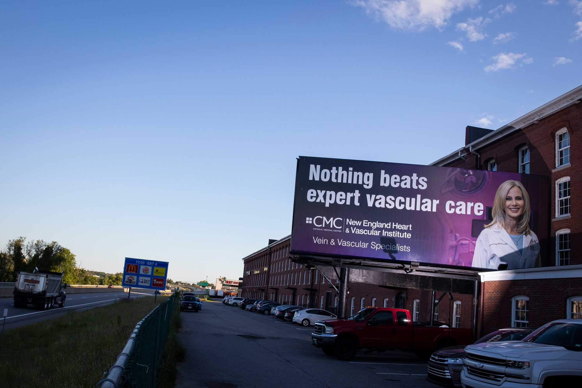 A billboard for Catholic Medical Center’s New England Heart & Vascular Institute is seen along Interstate 293 in Manchester, N.H. 
