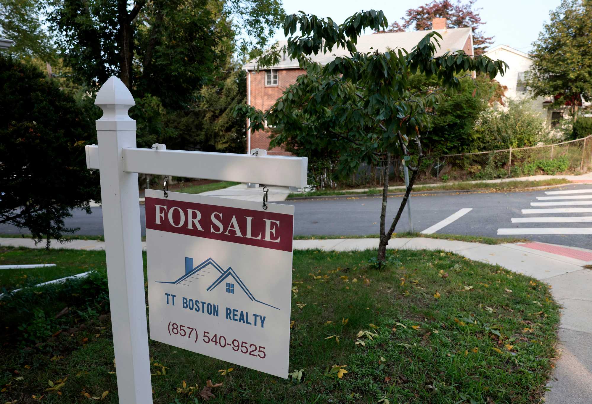 Watertown, MA — 9/27/2023 - A For Sale sign hangs outside of a home on Belmont Street in Watertown. (Jessica Rinaldi/Globe Staff) 