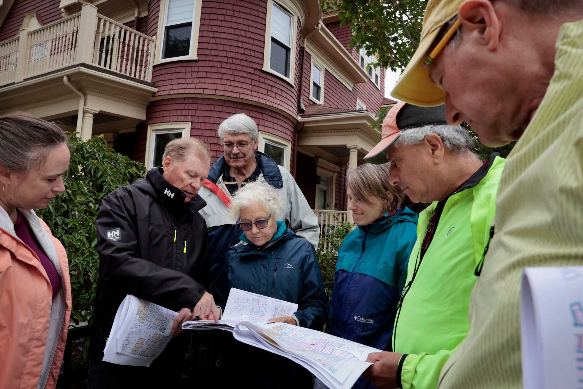 During a site walk of the town this summer, Brookline Planning Director Kara Brewton (left) talked with members of a committee considering zoning changes. Studying the zoning map were Ken Lewis, committee chairman Richard Benka, Linda Olson Pehlke, Katha Seidman, Neil Wishinsky, and David Pollak.
