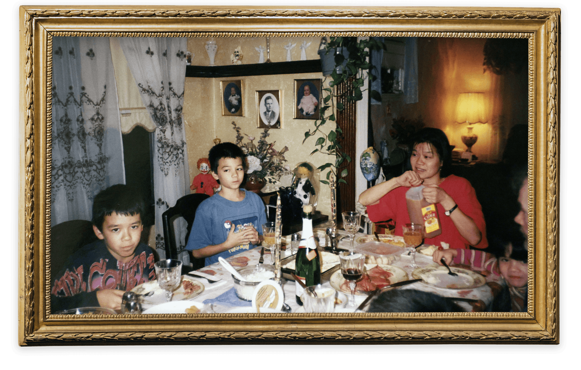 Brendan (left), Justin, and their mother, Patty Logue, sit at the Thanksgiving table at Dartmouth Street in 1999. 