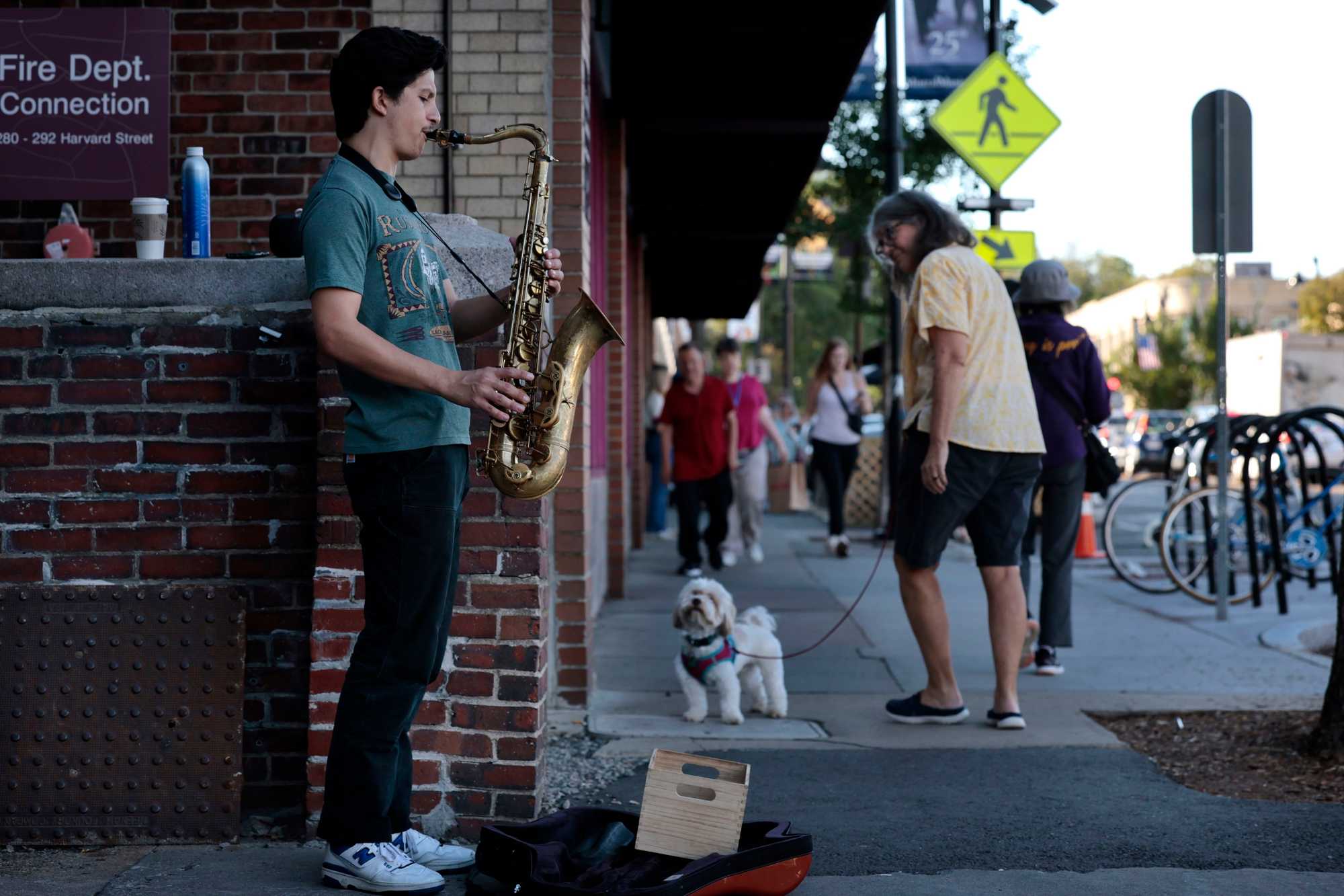 Colby Tinsley played jazz on Harvard Street in Coolidge Corner. Many residents want to preserve the neighborhood’s eclectic style. 