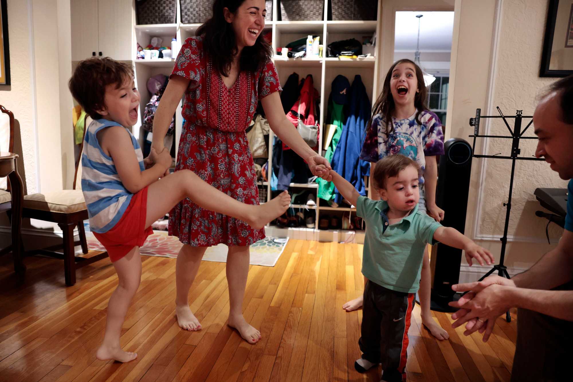 Amanda Zimmerman and Jeff Wachter at home with their children, Jacob, 6, (left) Alana, 9, and Micah, 2. The couple helped form a pro-housing group, Brookline for Everyone, after seeing other families priced out of the town. 
