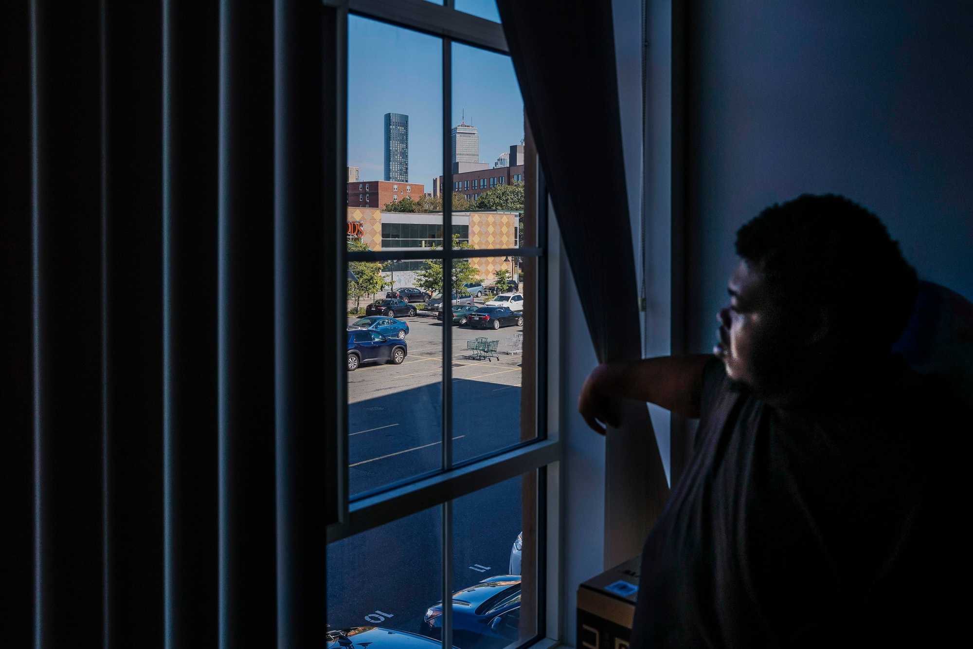 Looking out the window of his apartment in Roxbury’s Nubian Square, Alonzo White can see the Four Seasons One Dalton soaring into the sky. White, his mother, and a younger brother rent the three-bedroom apartment, one of 28 affordable units whose creation was funded by One Dalton’s developer in a set-aside agreement.