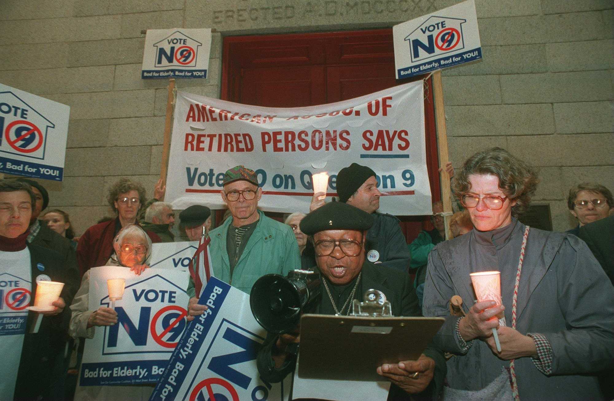 BOSTON-- Robin Vernon Carter leads a candle-light vigil in support of rent control at St. Paul's Cathedral. 11/6/94.