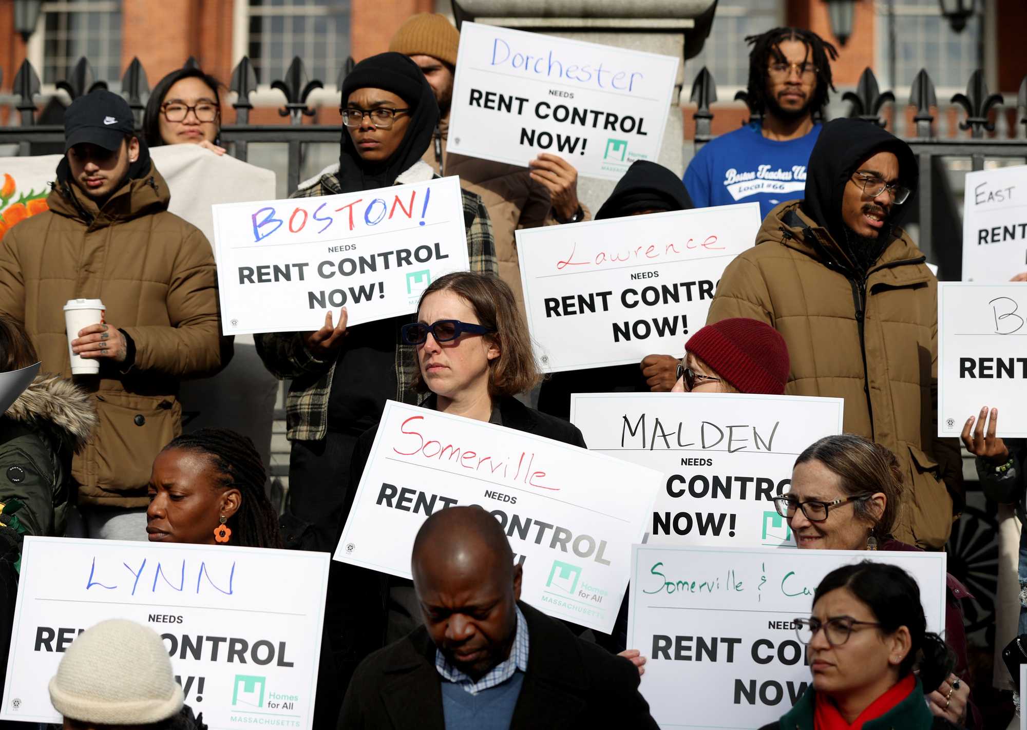 A coalition of groups rallied in front of the State House in November, calling for rent control. 