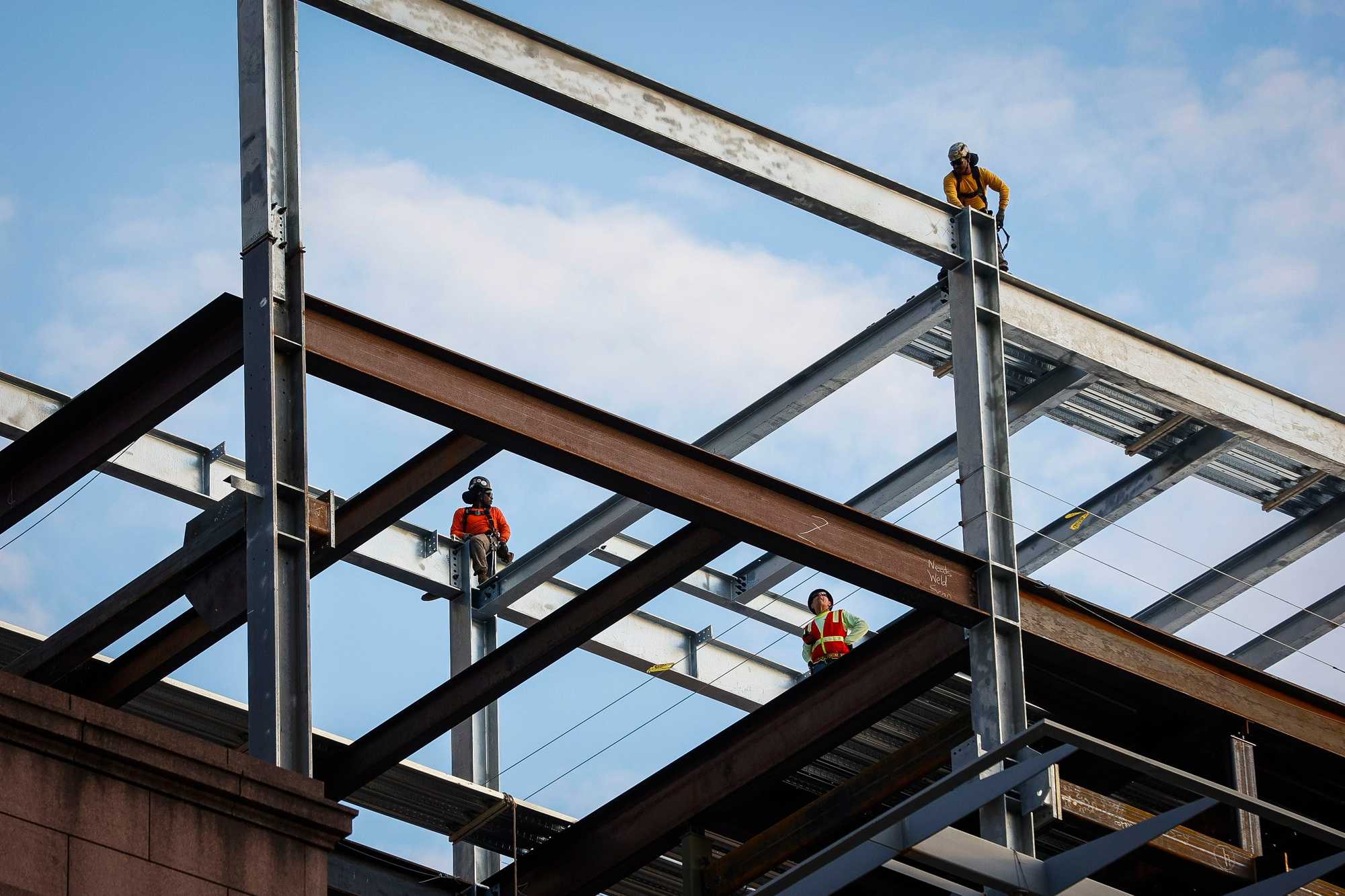 Construction workers building South Station Tower. Construction labor has been in short supply during what officials have described as the biggest building boom in Boston's history.