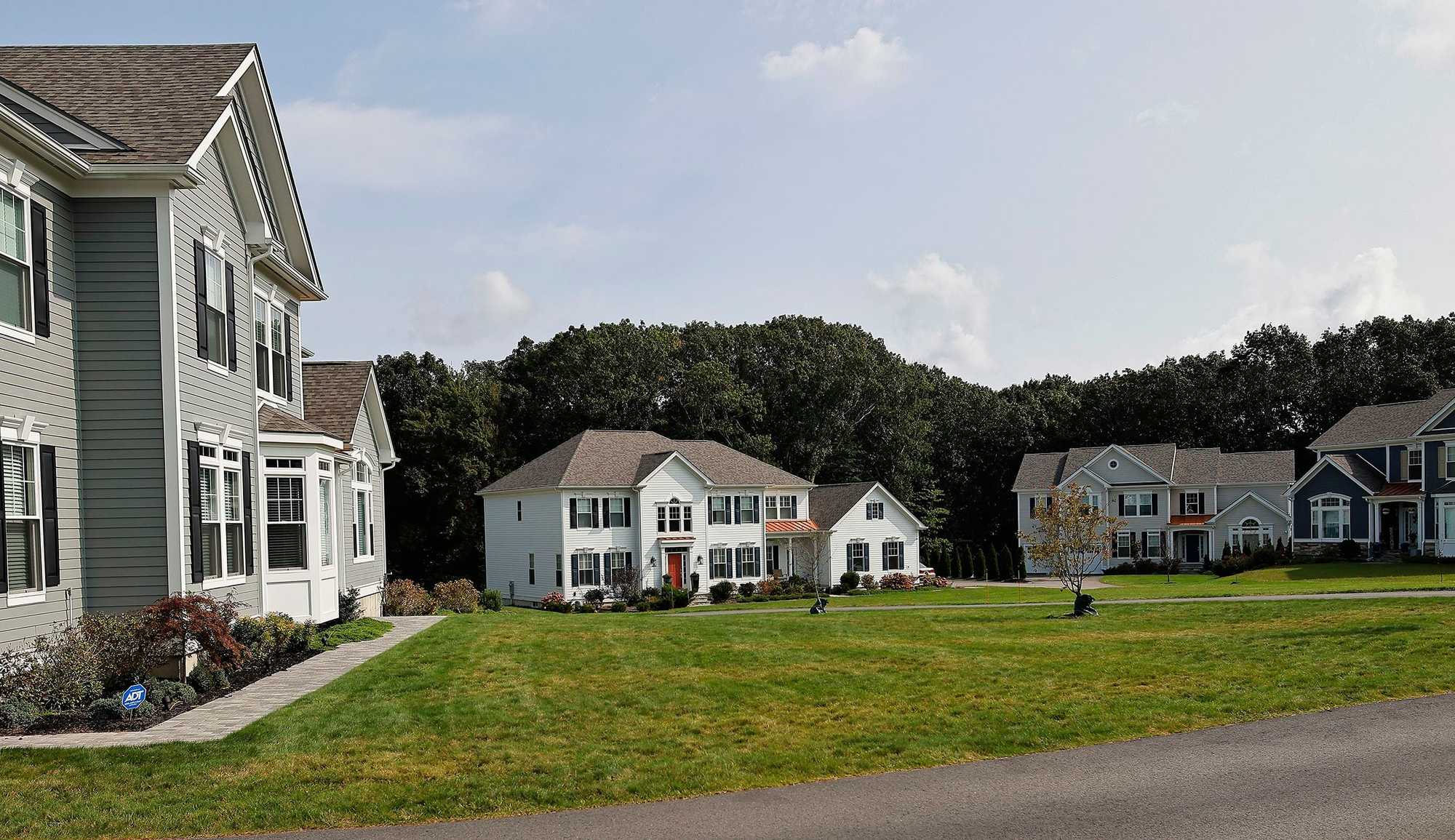 Milton, MA.  09/27/23 -  Luxury homes sit on the former Poor Farm site, most of which was sold to Pulte Homes, a high-end developer from Westborough.  The land had been bequeathed to Milton specifically for the poor in 1701 by William Stoughton, a Colonial-era governor.  The roots of the region’s housing issues lie in zoning laws that were passed, in some cases, before WWII.  Milton’s zoning requires single-family homes with few exceptions, making it a pleasant suburb, but exacerbating a housing shortage as well as traffic congestion.  (Lane Turner/Globe Staff) Reporter: (Patty Wen)  Topic: (xxhousingcrisis)