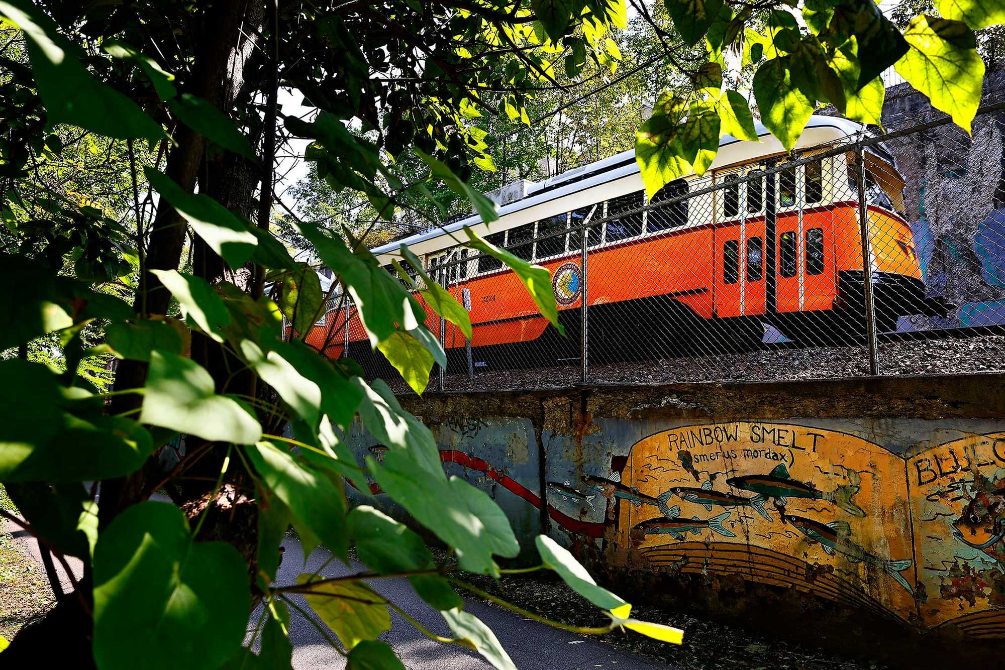 The Mattapan Trolley trundled alongside the Neponset River Greenway Trail. The trolley makes four stops in Milton, which is why the town is required under state law to amend its zoning by the end of this year to allow more apartments and condos.
