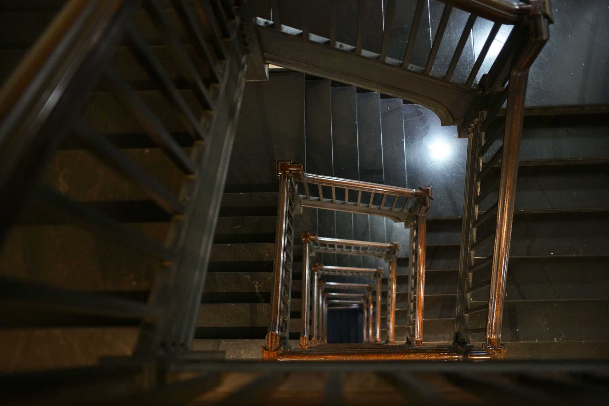 A view of a staircase at the Parkside, a Fenway building that dates to the dawn of the 20th century.