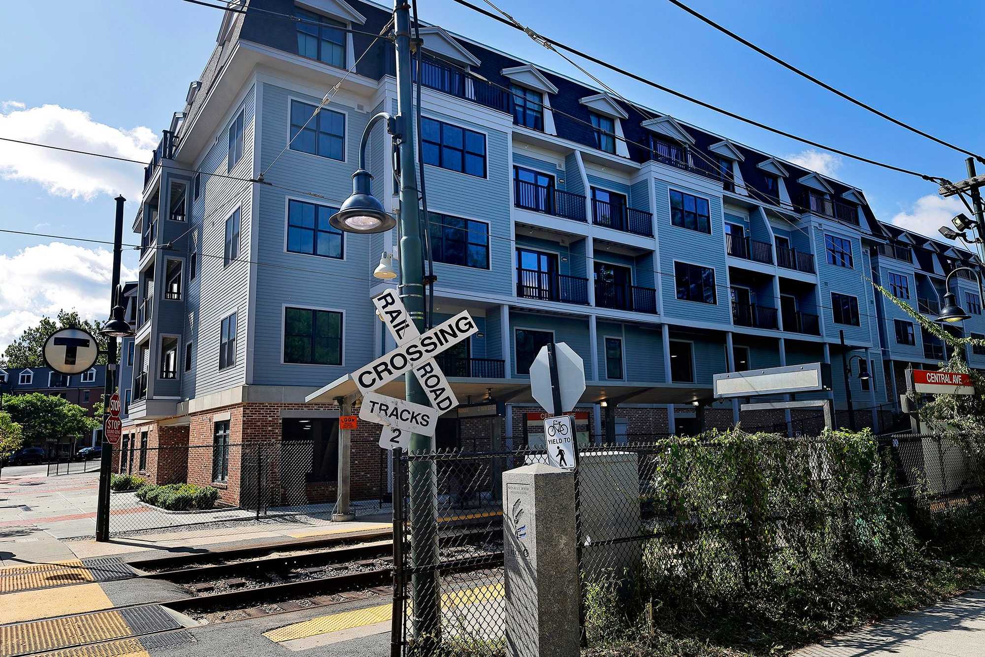 Milton, MA.  09/19/23 -   Adjacent the Mattapan Trolley stop at Central Station, the Hendries at Central Station luxury condo development is an example of multifamily housing that Milton has allowed.  The roots of the region’s housing issues lie in zoning laws that were passed, in some cases, before WWII.  Milton’s zoning requires single-family homes with few exceptions, making it a pleasant suburb, but exacerbating a housing shortage as well as traffic congestion.  (Lane Turner/Globe Staff) Reporter: (Patty Wen)  Topic: (xxhousingcrisis)