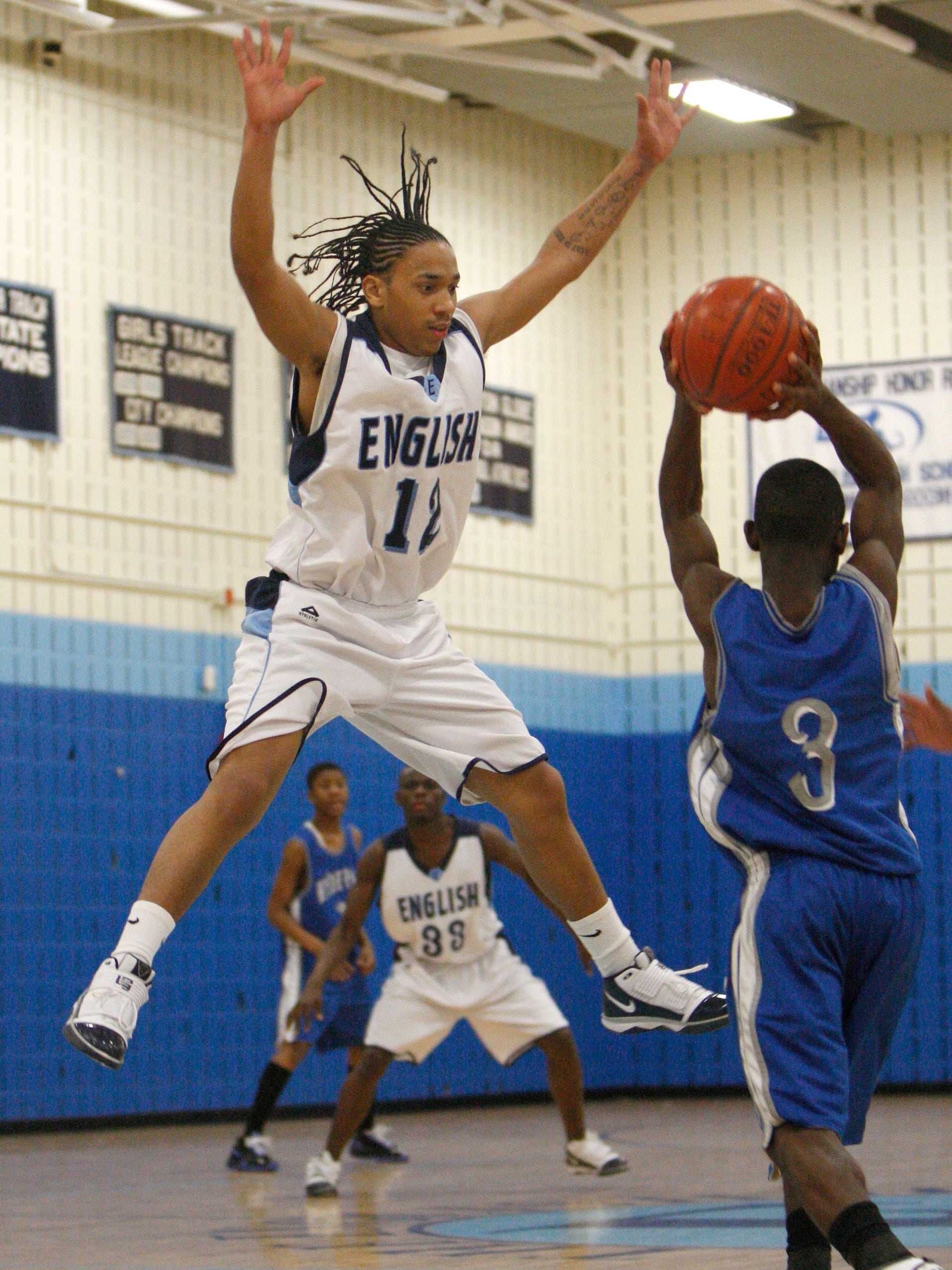 Alex DoSouto, applying defensive pressure during an English High game against Hyde Park High in 2010, was his team's most valuable player and a Boston City League All-Star. 