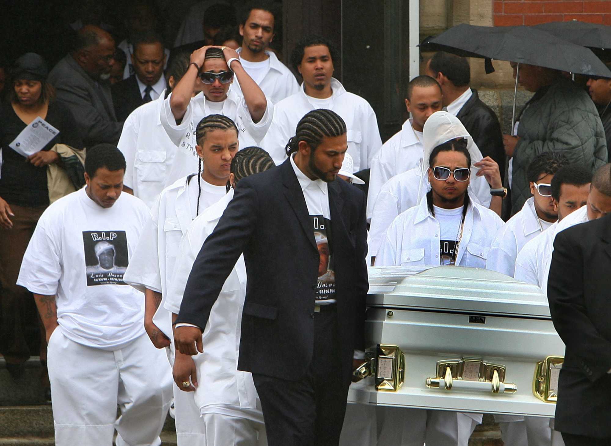 The casket of Luis DoSouto, the oldest of 10 children, was carried from St. Patrick Church in Roxbury after he was shot to death in front of his family's home in 2006.  A popular chef, he died at age 25.