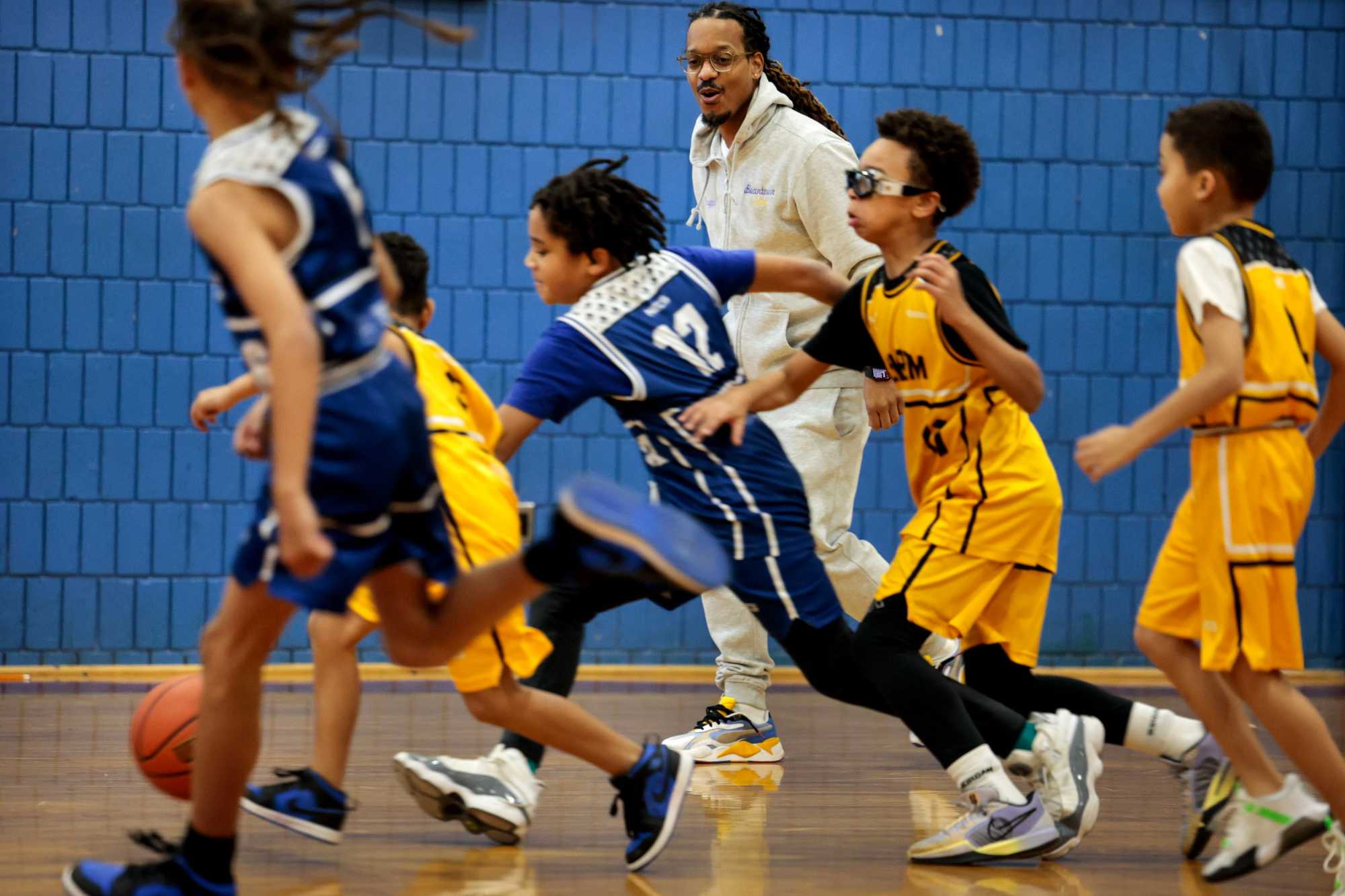  Steve "Nugget" DoSouto, coaching and officiating a game during the Lil Rim basketball program at the Holland Community Center in Dorchester, has dedicated his life to saving children in the community from violence.