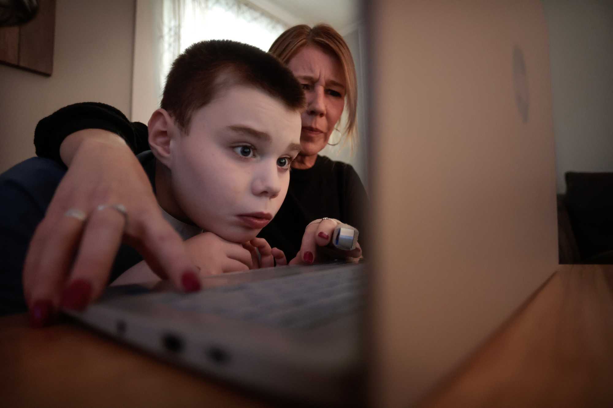 Jennifer Fowler helped her son Dante during his virtual, “morning meeting” at their home in Wakefield. Jen compared the “morning meeting” to the “circle time” he would have at school, when they discuss weather, emotions, the date, and day of week.
