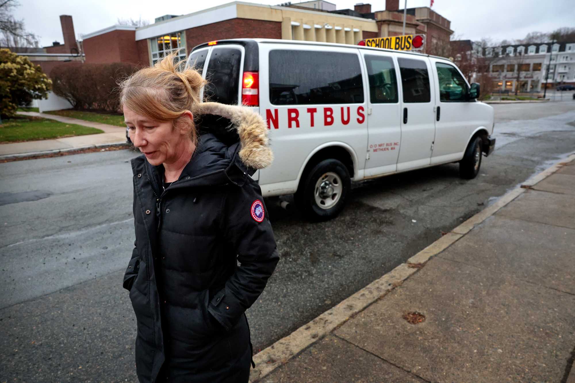 Jen Fowler headed back to the house as her son Dante departed on a school bus outside their home in Wakefield in April. The bus would transport Dante to his first day at the Amego School in Franklin.