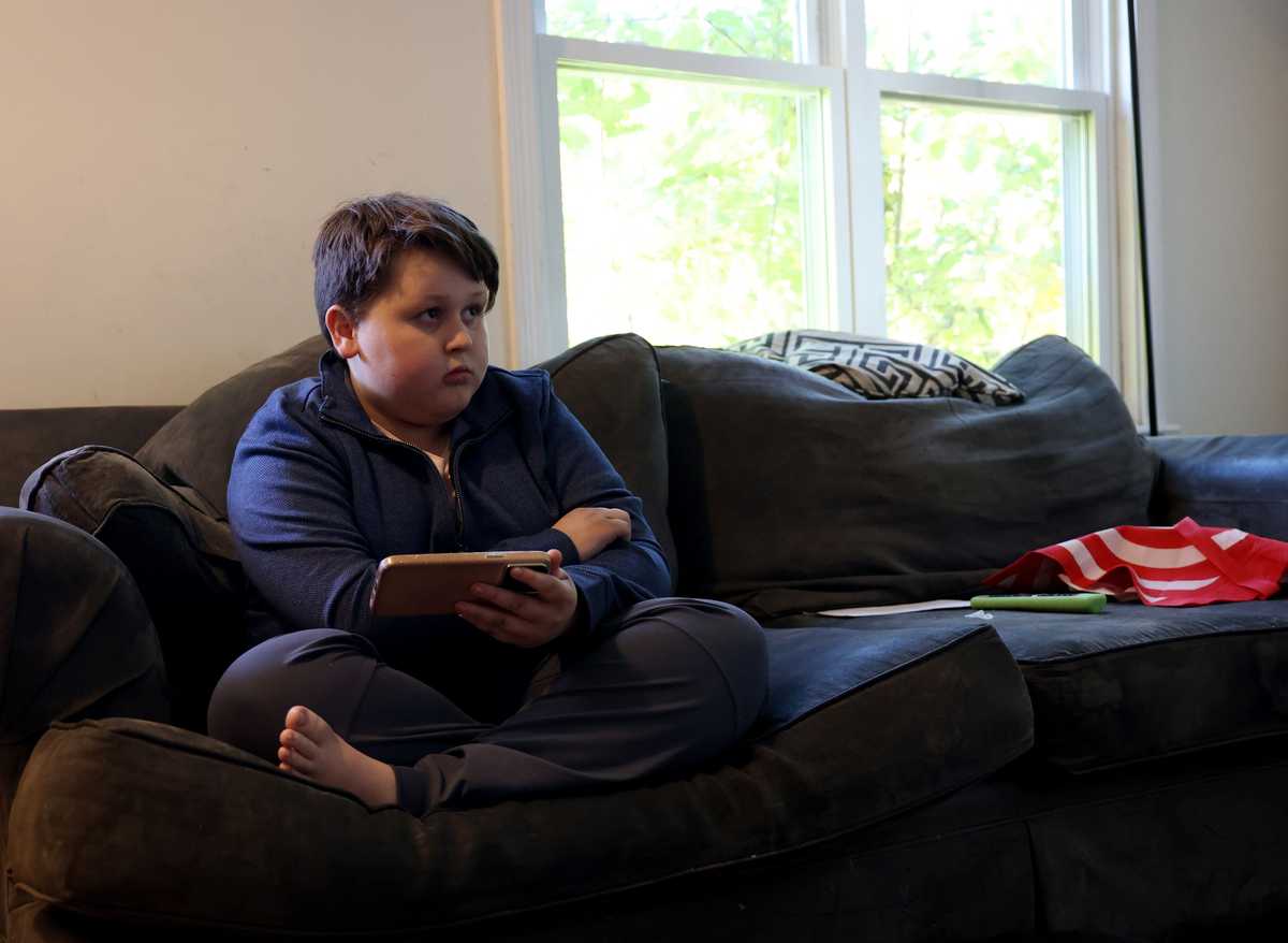Will Lambert, 10, played on his mother’s phone after school as he sat in the family’s living room. Will has autism and is sweet natured with his family's cat. But he can become agitated and turn violent. His parents believe he needs to be placed at a special school to help him cope with his disability so he doesn't hurt himself or others, but his school district disagrees. The Lamberts can't afford an attorney to advocate on their behalf.
