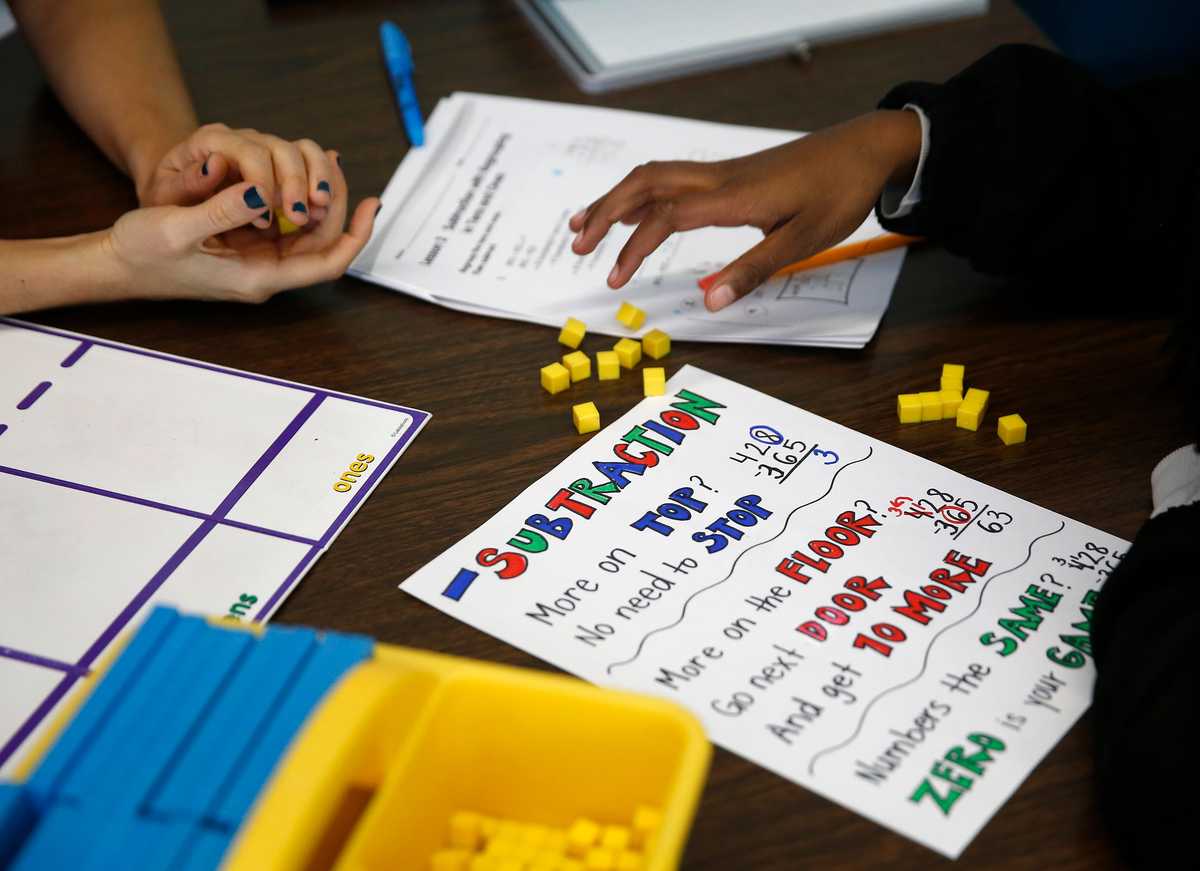 A teacher worked with a fifth-grader on math in the special education room at Bridge Boston charter school in Dorchester.