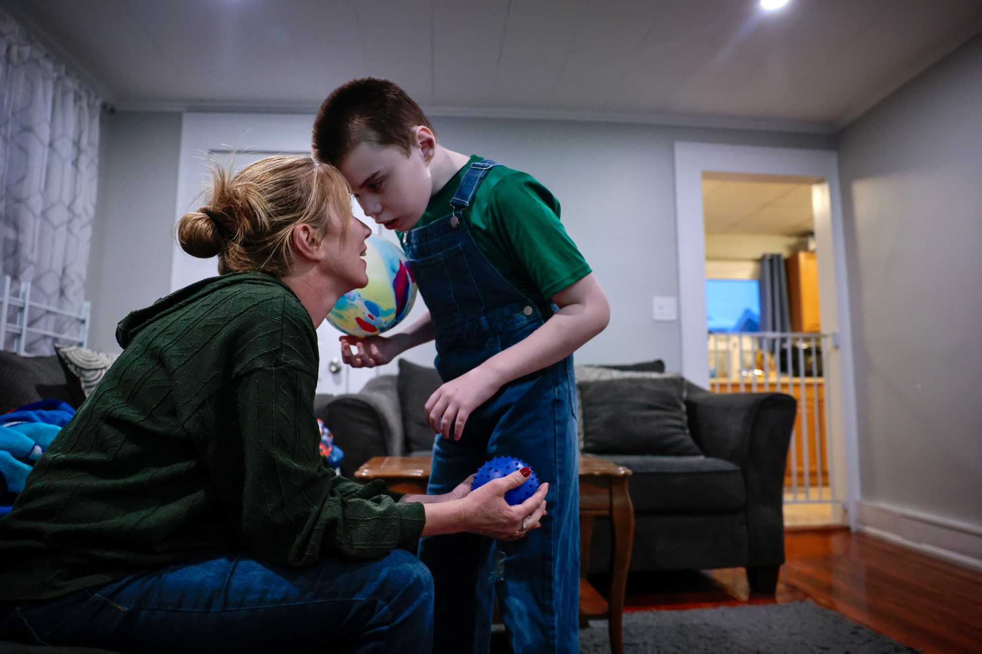 Dante affectionately touched foreheads with his mother at their home in Wakefield in February. He had calmed down after an episode earlier in the day.