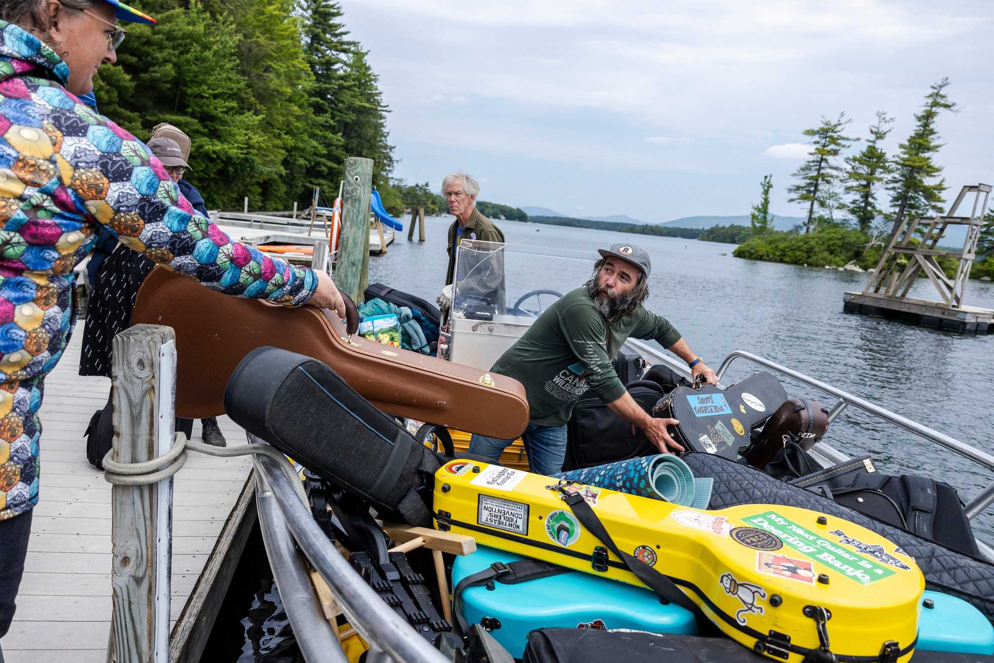Joey Thieman loaded instruments into the Sea Dog during one of many trips shuttling departing campers and their gear from Three Mile Island at the end of Miles of Music Island Camp in New Hampshire.