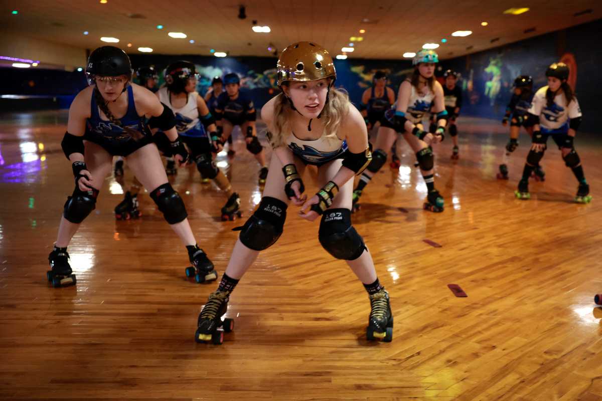 GoldiBlocks (Genevieve "Gigi" Snell) is front and center during an early workout with  the New England Junior Roller Derby team at Roller World in Saugus, MA February 9, 2025. 