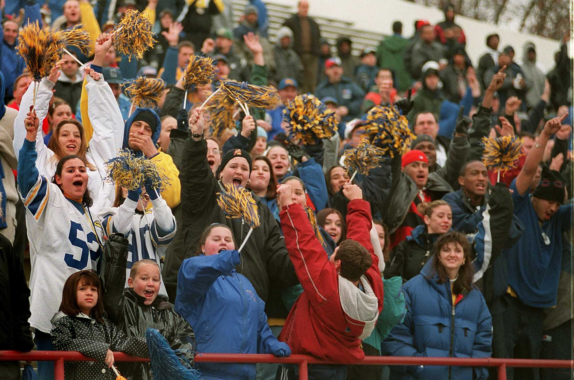 East Boston fans celebrate a touchdown against South Boston during their 1998 Thanksgiving Day rivalry game.