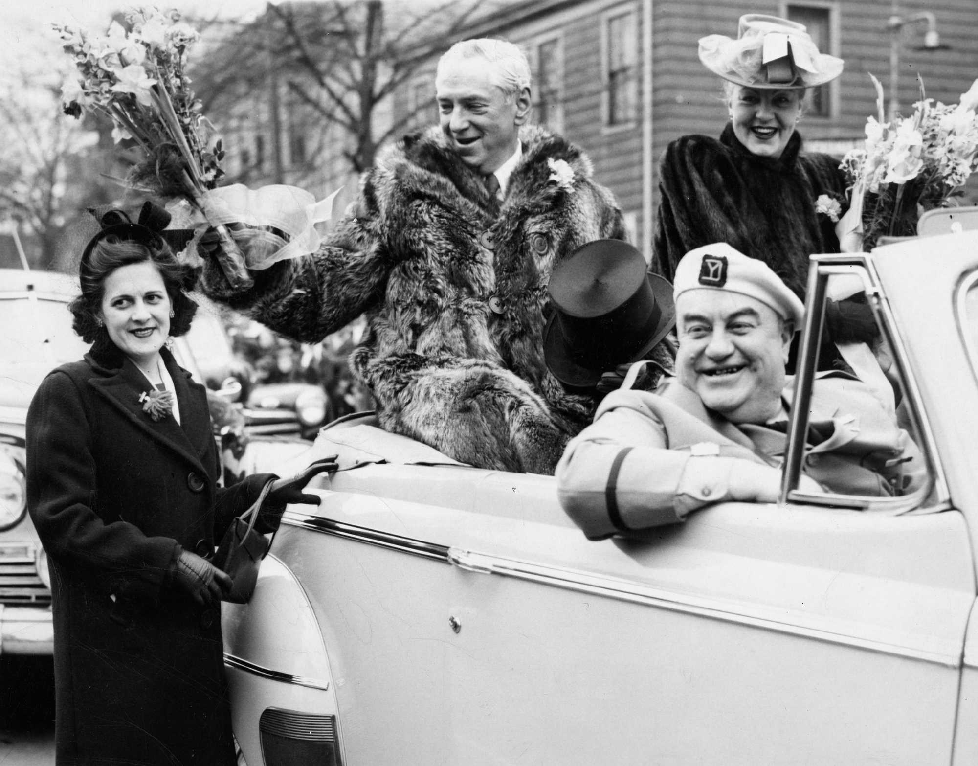 Mayor James Curley, dressed in a raccoon coat, during the South Boston Evacuation Day parade on March 17, 1947. The mayor at the time of White Stadium's opening, Curley once predicted the stadium would expand to hold 100,000 people. He later served as the chairman of the White Fund board.