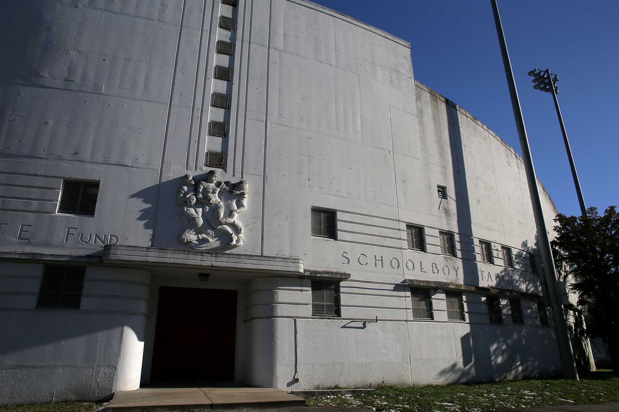 The facade of White Stadium, built in the Art Deco style, features a sculpture of its intended use: schoolboy football.