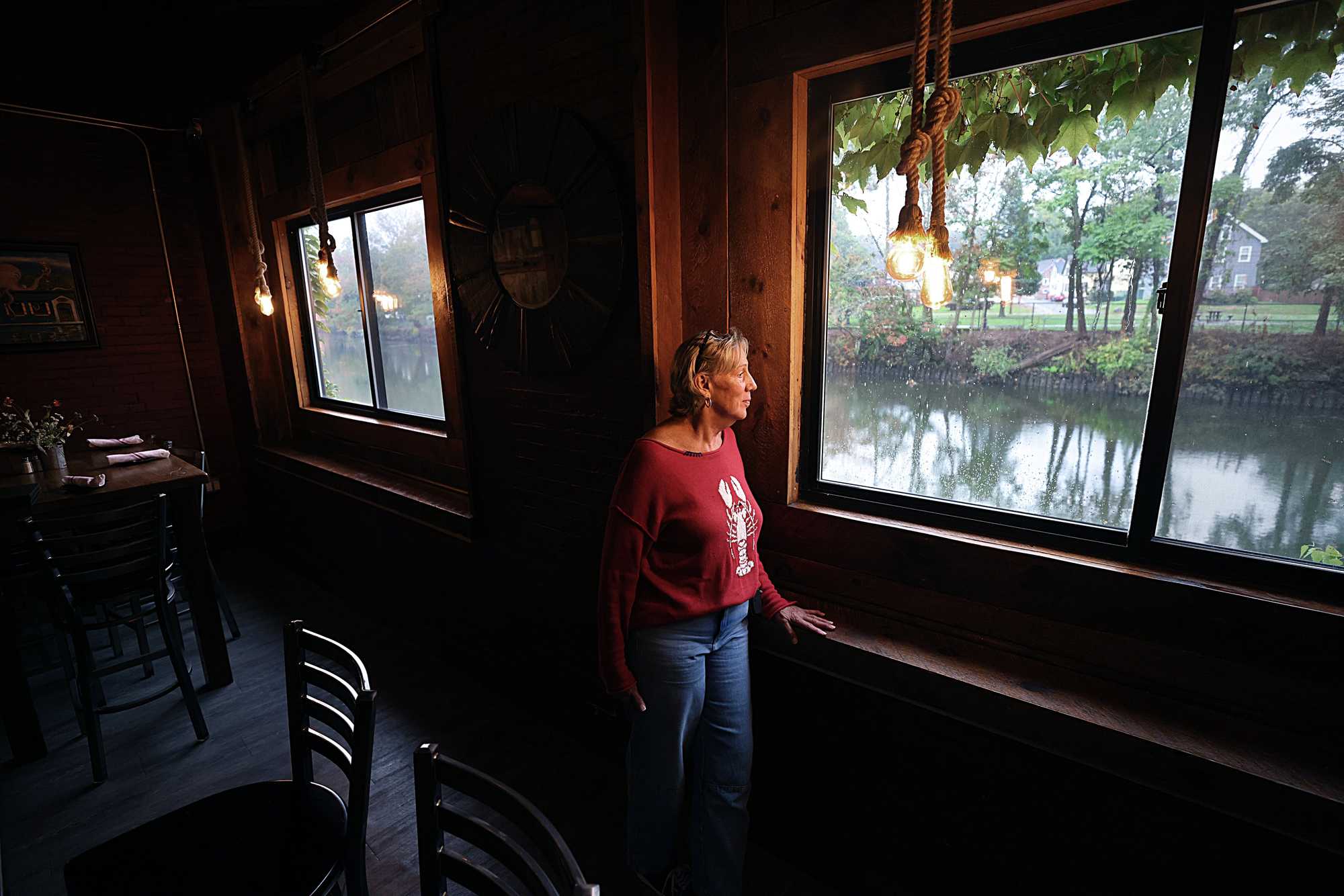 Cheryl Latour, owner of the Riverhouse restaurant in Taunton, looked out onto the Taunton River.