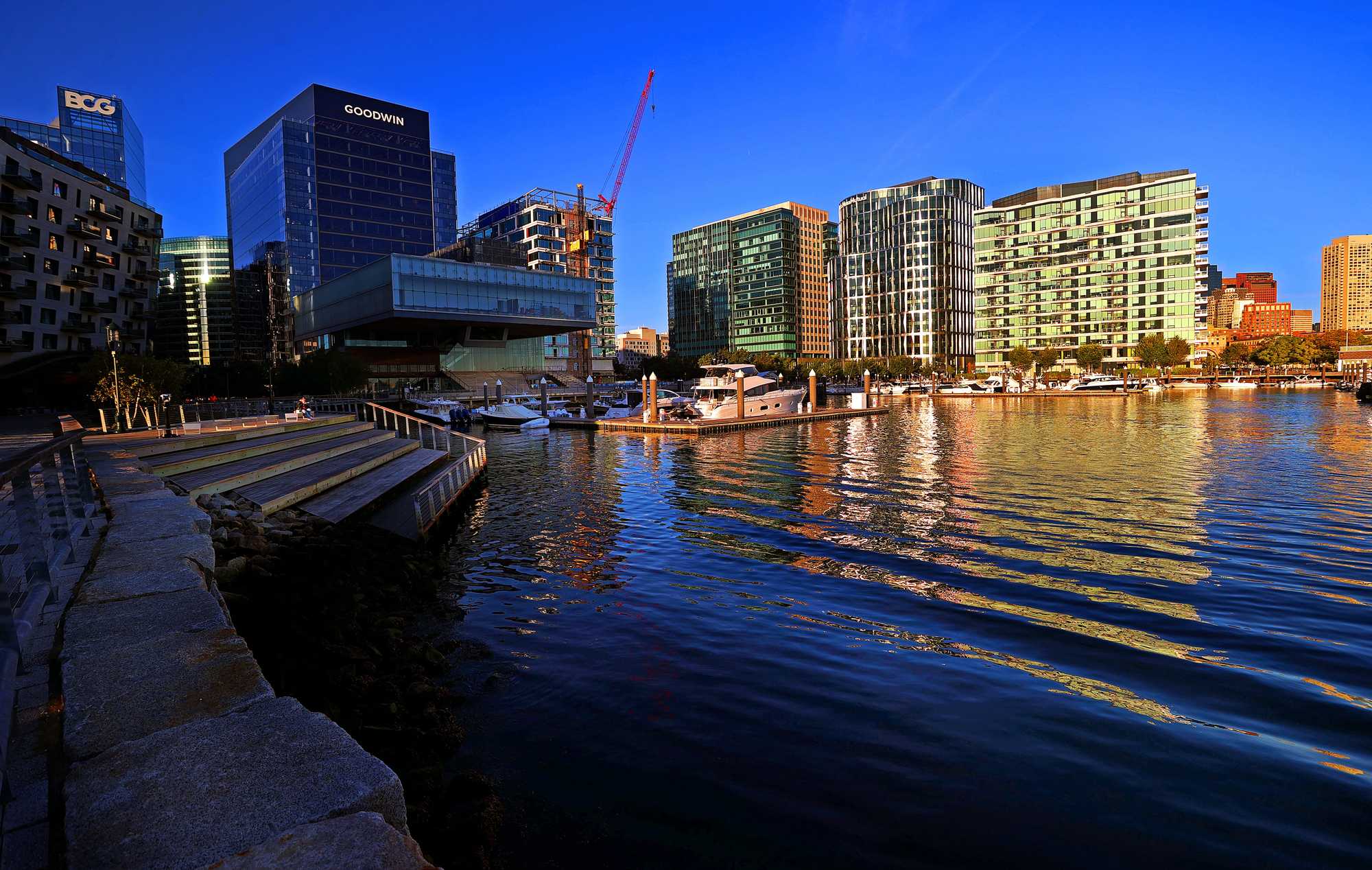 Over the past two decades, a sea of asphalt on the South Boston Waterfront has transformed into the Seaport, a bustling neighborhood full of office buildings, shopping, and high-end housing that has powered the city's tax base. But its prosperity is at risk due to rising seas. (David L. Ryan/Globe staff)