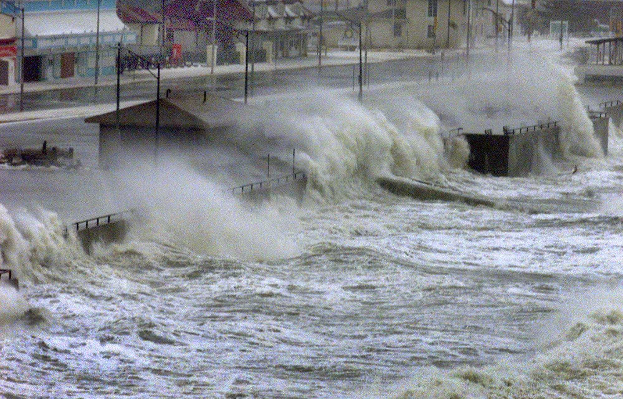 Waves crashed over the sea wall at Hull's Nantasket Beach.