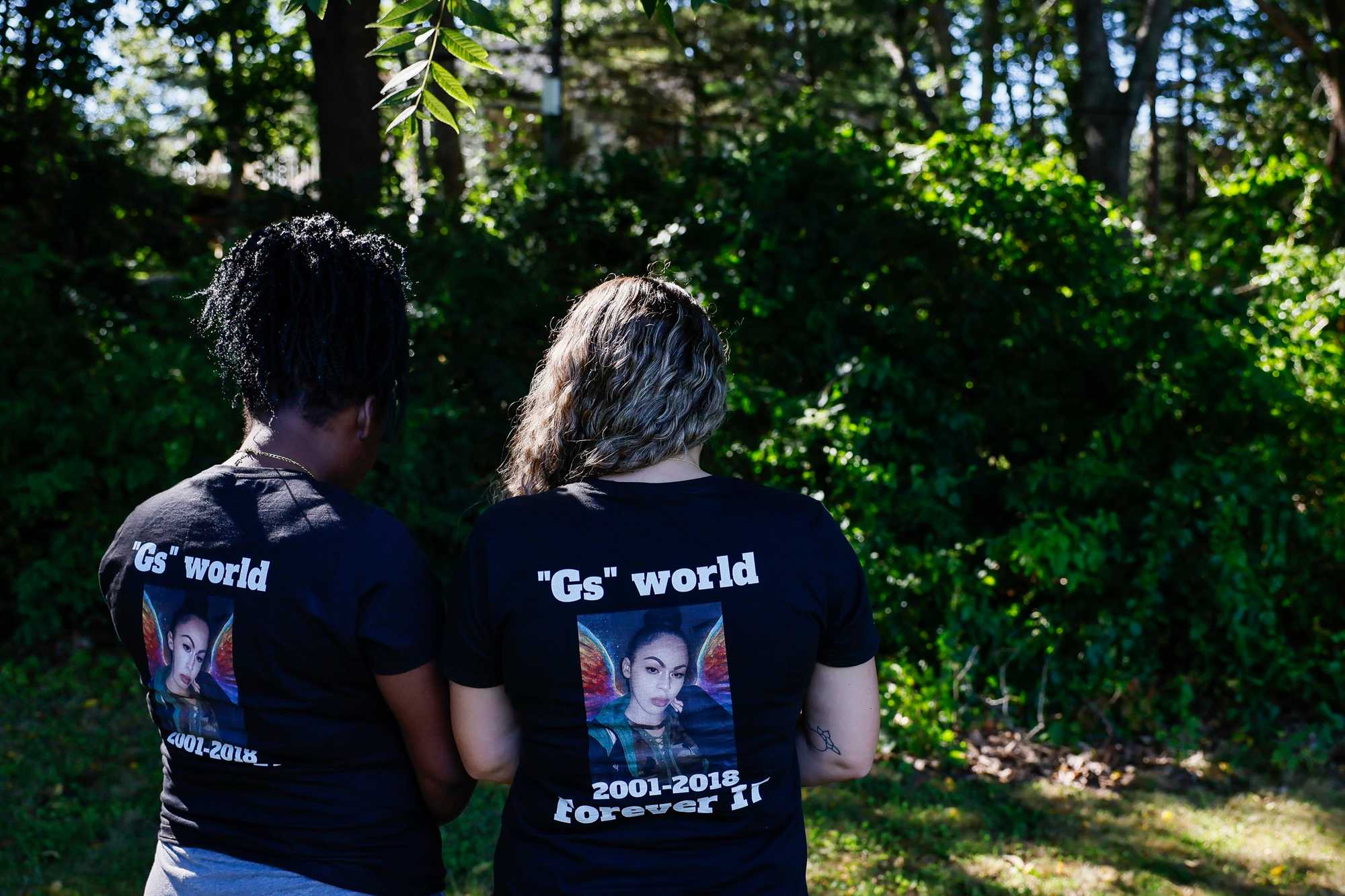 Friends Tyla Ordoñez (left) and Skye Foote wore shirts honoring G Araujo, a teen who died in 2018 after running away from a group home where she had been placed by the Department of Children and Families.