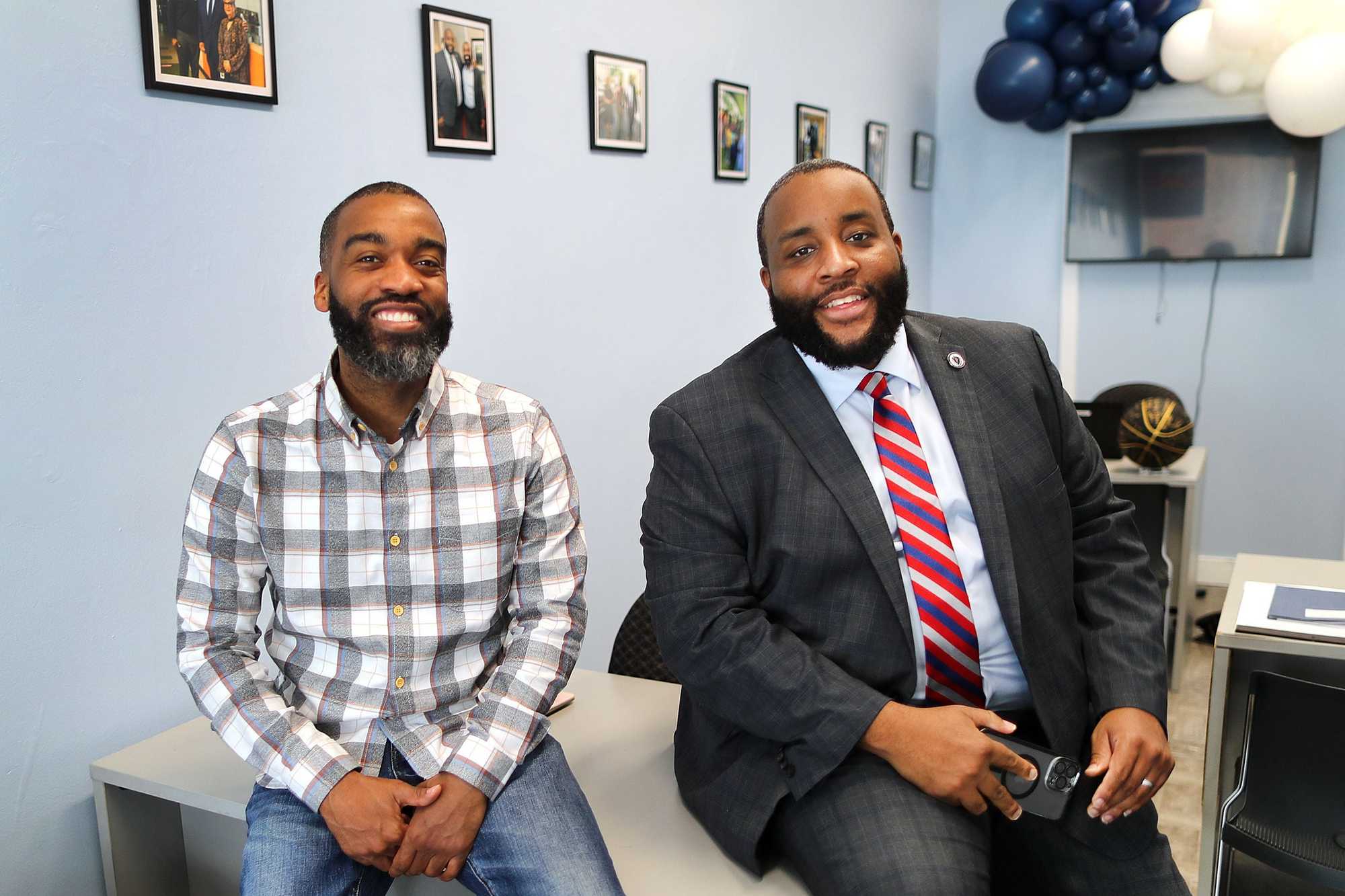 Boston City Councilor Brian Worrell (left) and his brother, state Representative Chris Worrell, in a district office in March 2023. 