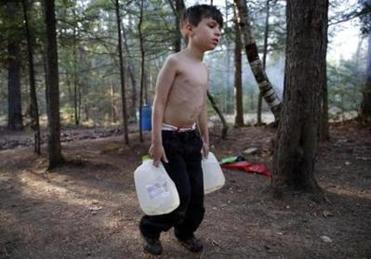 Strider struggled as he carried gallons of water filled from a spigot to the camper. Lanette would heat the water on a small stove to do the dishes and bathe the boys with a washcloth. The family bounced around from campground to campground, after being evicted last summer for falling behind on their rent.