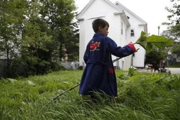 Still wearing his bathrobe on the first morning at his new home, Strider played with sticks and leaves in a backyard that was so different from the woods where he had spent the summer.