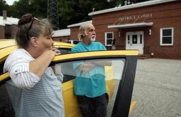 Lanette and Larry stood outside of District Court after waging an unsuccessful attempt to regain entry to the trailer. The new owner eventually agreed to box up the family photos left behind and leave them at the police station for the Grants to retrieve.