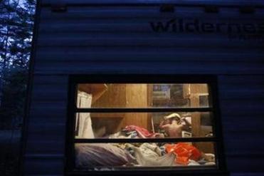 Strider pulled his pajamas over his head as he changed in Lanette and Larry’s bedroom inside the cramped camper. Recently evicted from their home, the family of four was squeezed into the 24-foot camper.