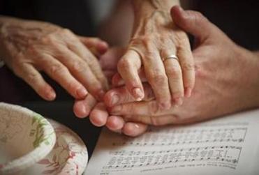 Congregants at Sanctuary anointed each other’s hands with hand balm as part of a Maundy Thursday prayer service.