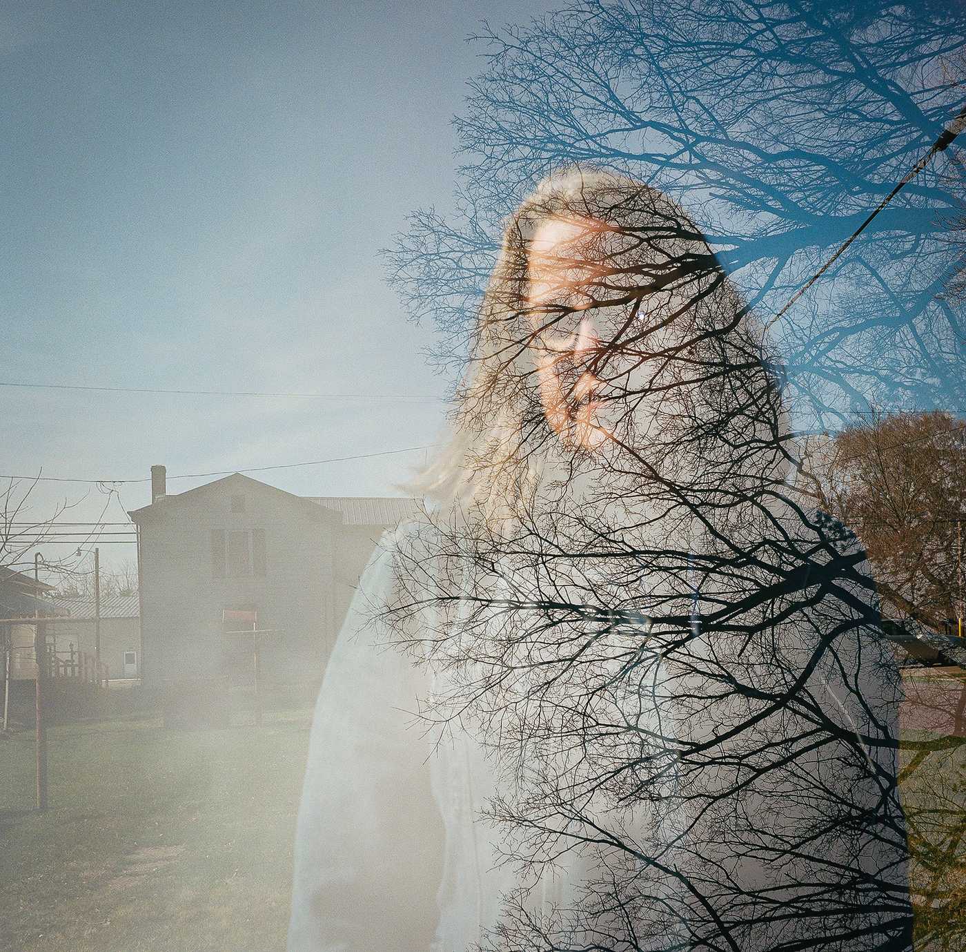 A double-exposure of Kate overlaid with the woods at the rest area that haunts her memories. 