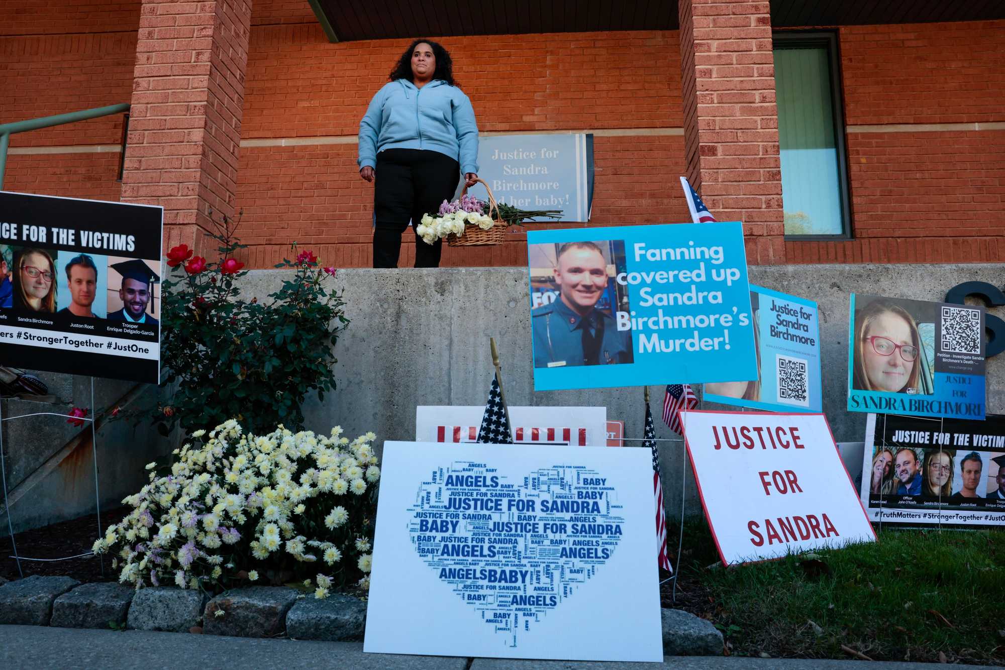 Community members gathered outside Stoughton police headquarters in October demanding "Justice for Sandra Birchmore." 