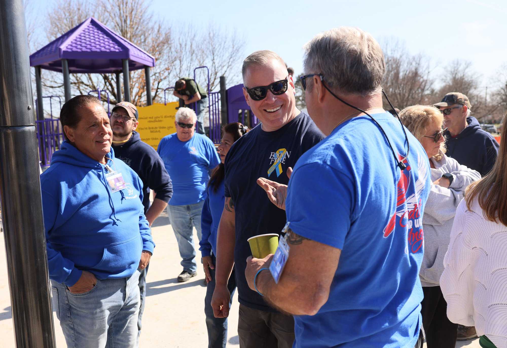 Jimmy Plourde chatted with other volunteers who came together to help build a playground for Where Angels play, an organization spun out of the Sandy Hook massacre that builds playgrounds in underserved areas.