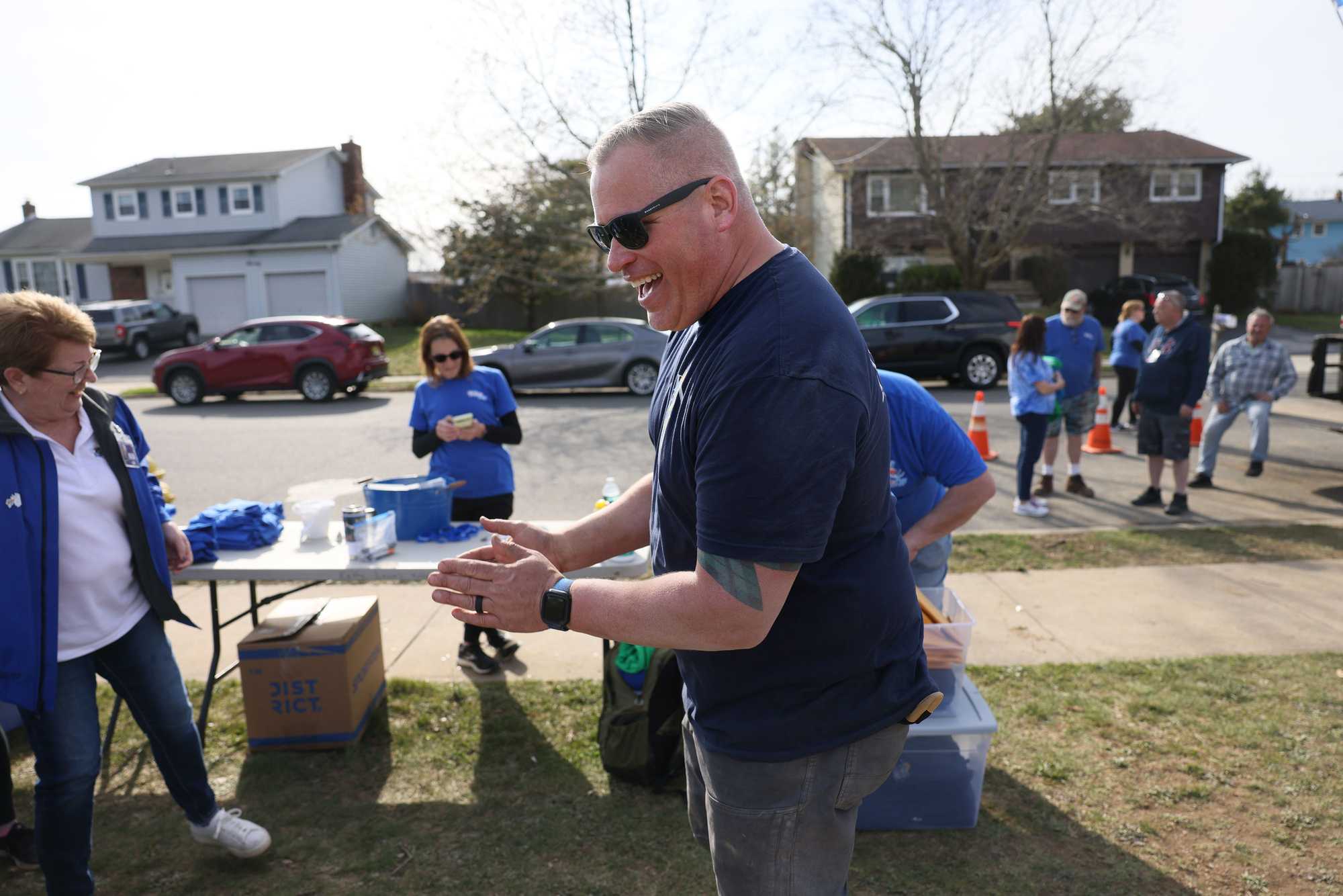 Firefighter Jimmy Plourde laughed with other volunteers who came together to help build a playground for Where Angels Play, an organization spun out of the Sandy Hook massacre that builds playgrounds in underserved areas.