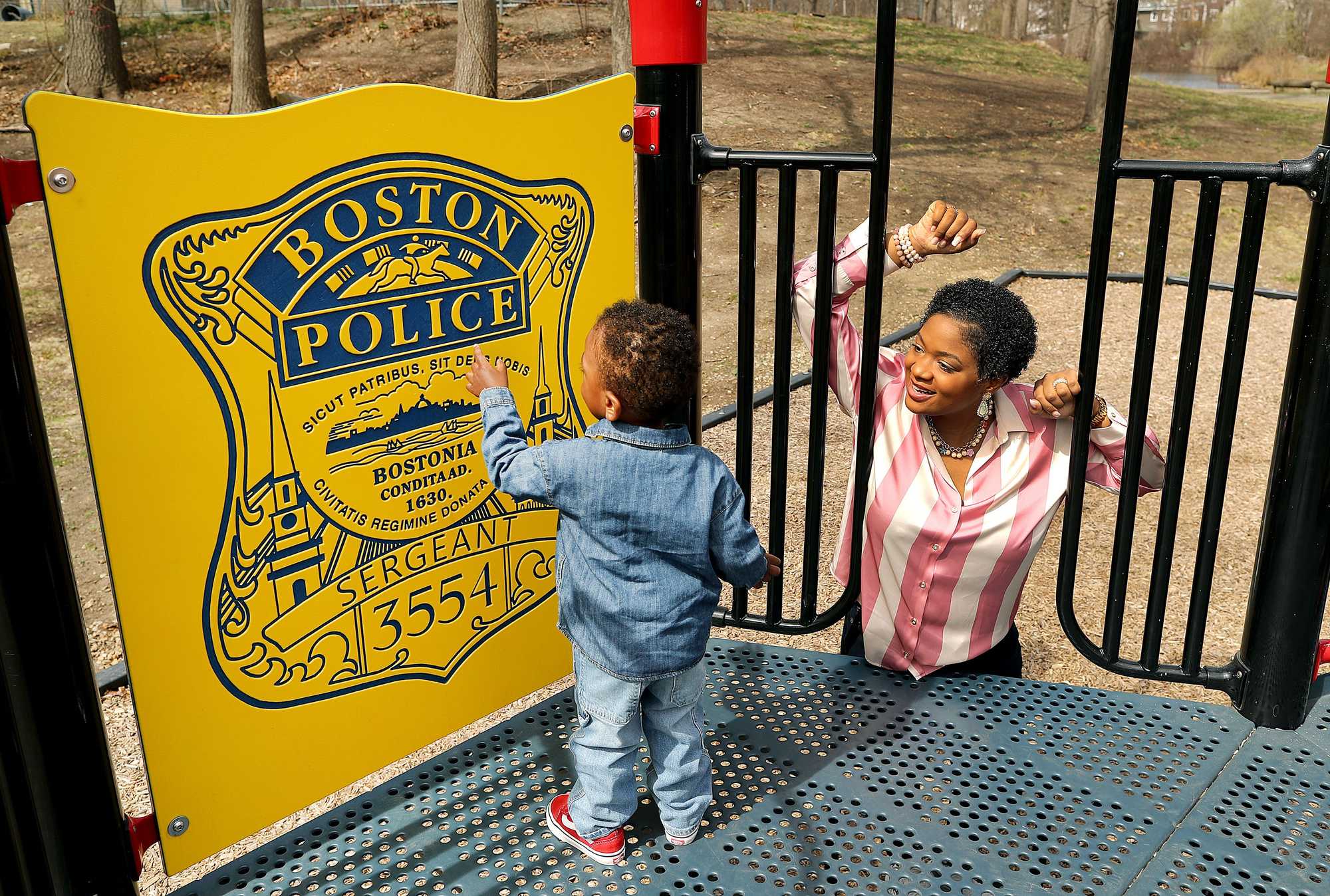 Nicole Simmonds-Jordan with her son, Knight Dennis, at a playground dedicated to DJ Simmonds. 