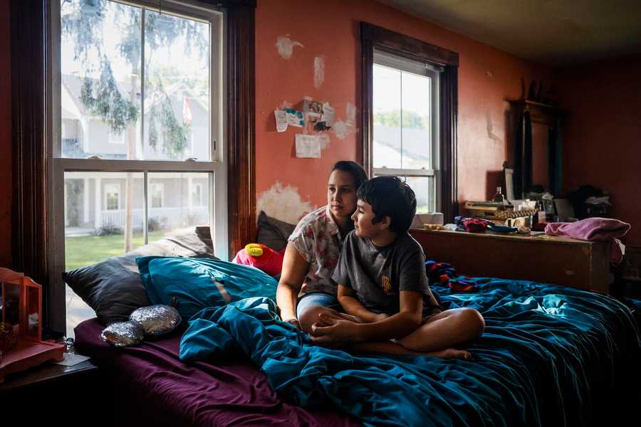 NORTH BROOKFIELD, MA - 9/1/2023 Tashena Marie sits for a portrait with her son Andrew Boucher in their North Brookfield home on Friday. Boucher just started 9th grade and is reading at a 4th grade level.  Erin Clark/Globe Staff 

LITERACY 