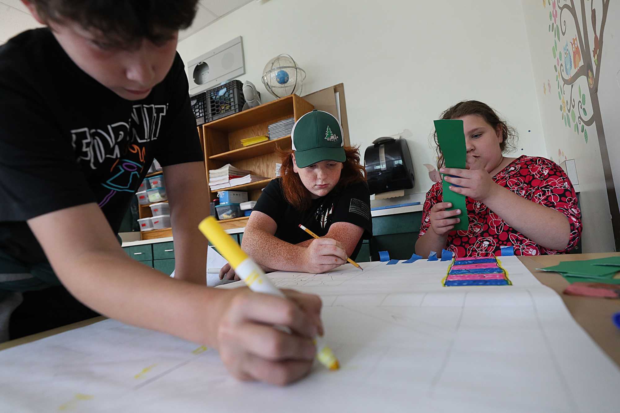 At Hawlemont Regional Elementary School, fifth-grader Jared Lanoue (center) worked with classmates on making board games related to texts they’d been reading.