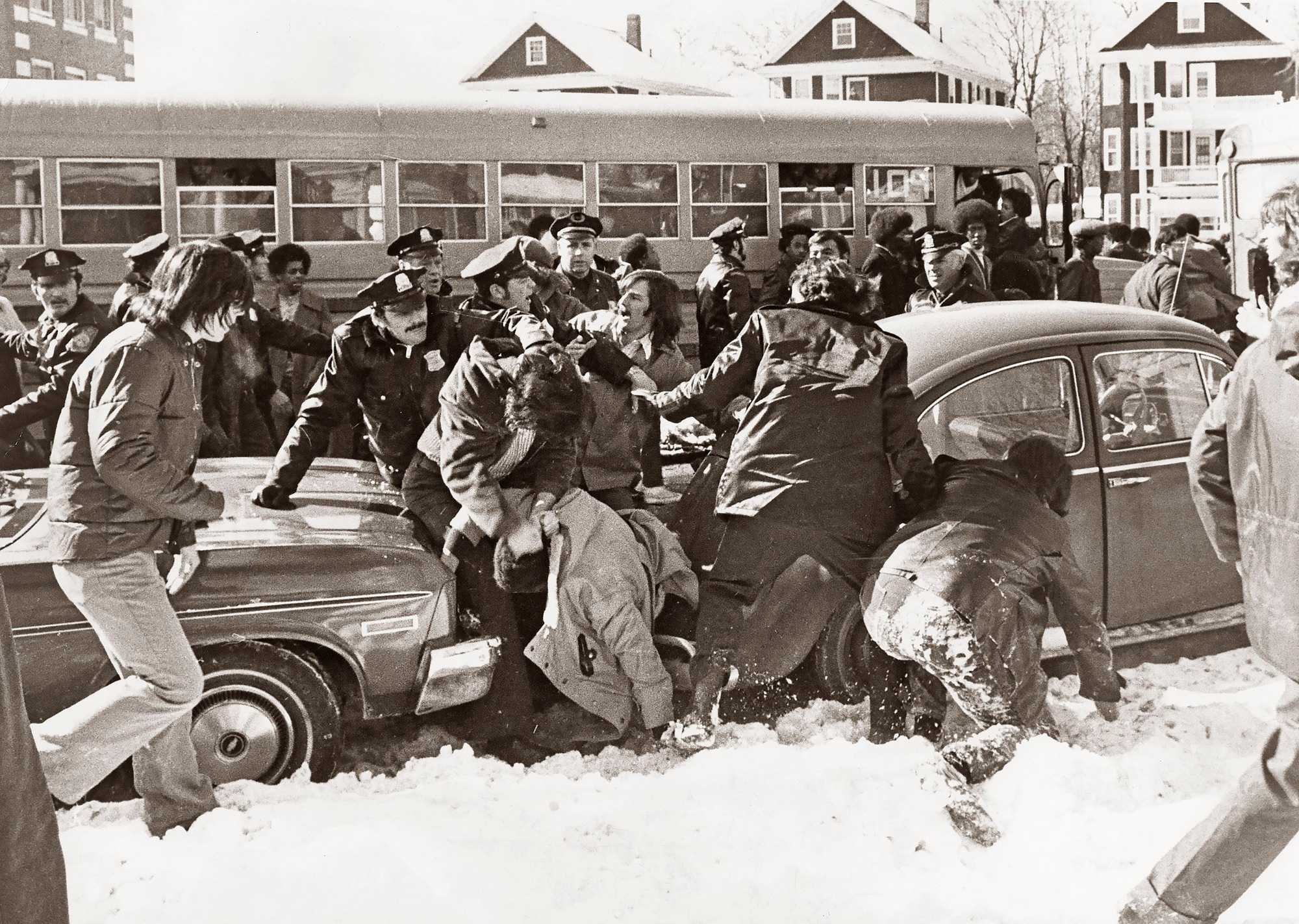 Police stepped in as a fight erupted between students in front of Hyde Park High School in Boston at dismissal time on Feb. 14, 1975.  (Paul Connell/Globe Staff)