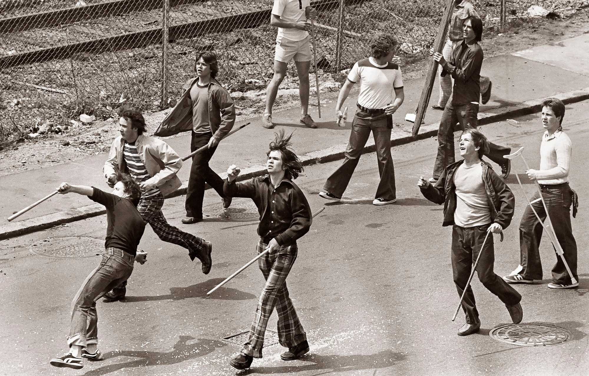 South Boston youths followed members of the Progressive Labor Party who had gathered for a national march against racism in 1975.