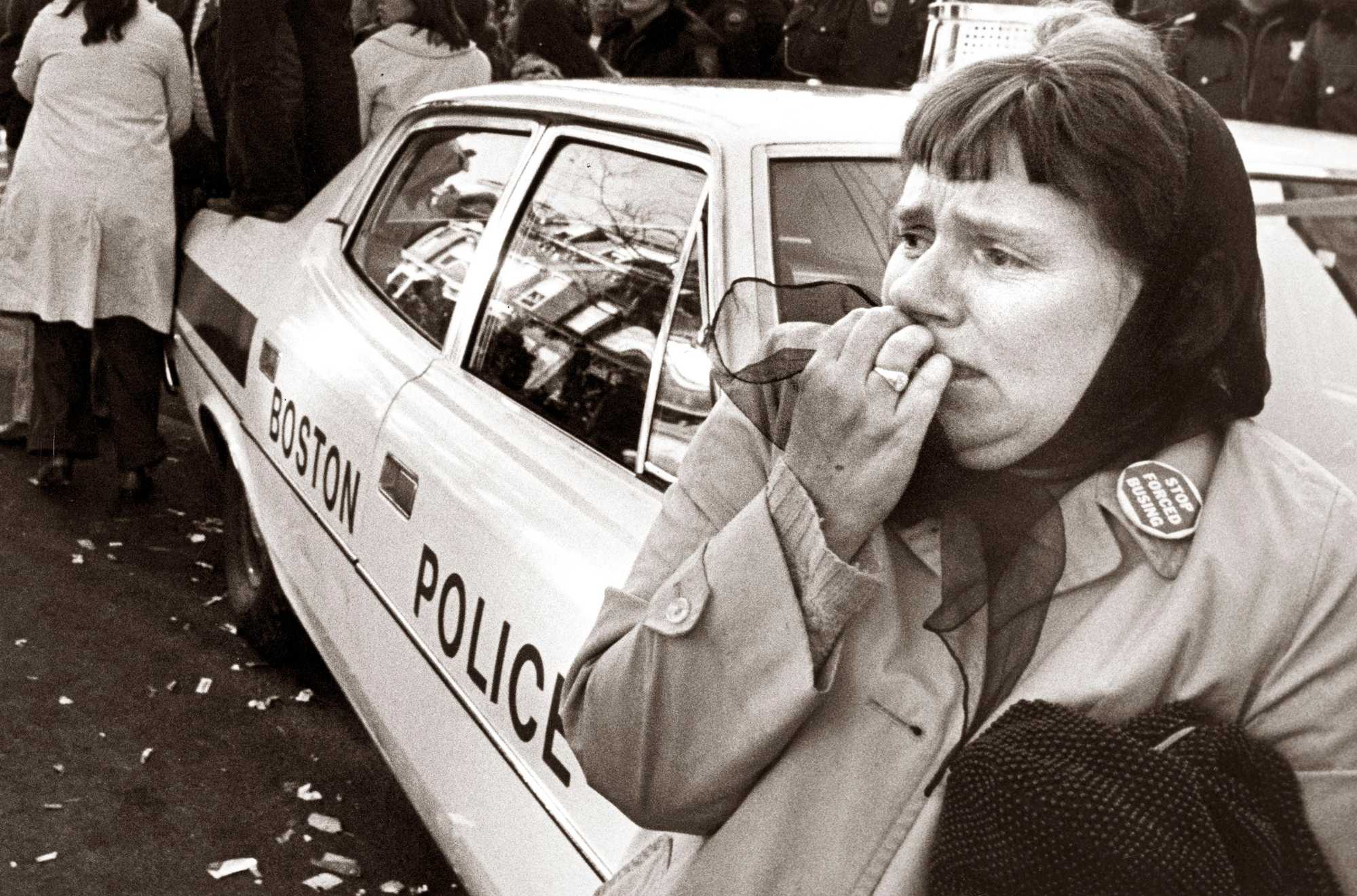 A resident of South Boston reacted during a riot near South Boston High School on Dec. 11, 1974. The clash between police and a crowd of 1,500 people outside the school after a white student was stabbed inside the school led to the closing of seven public schools for the remainder of the week. 