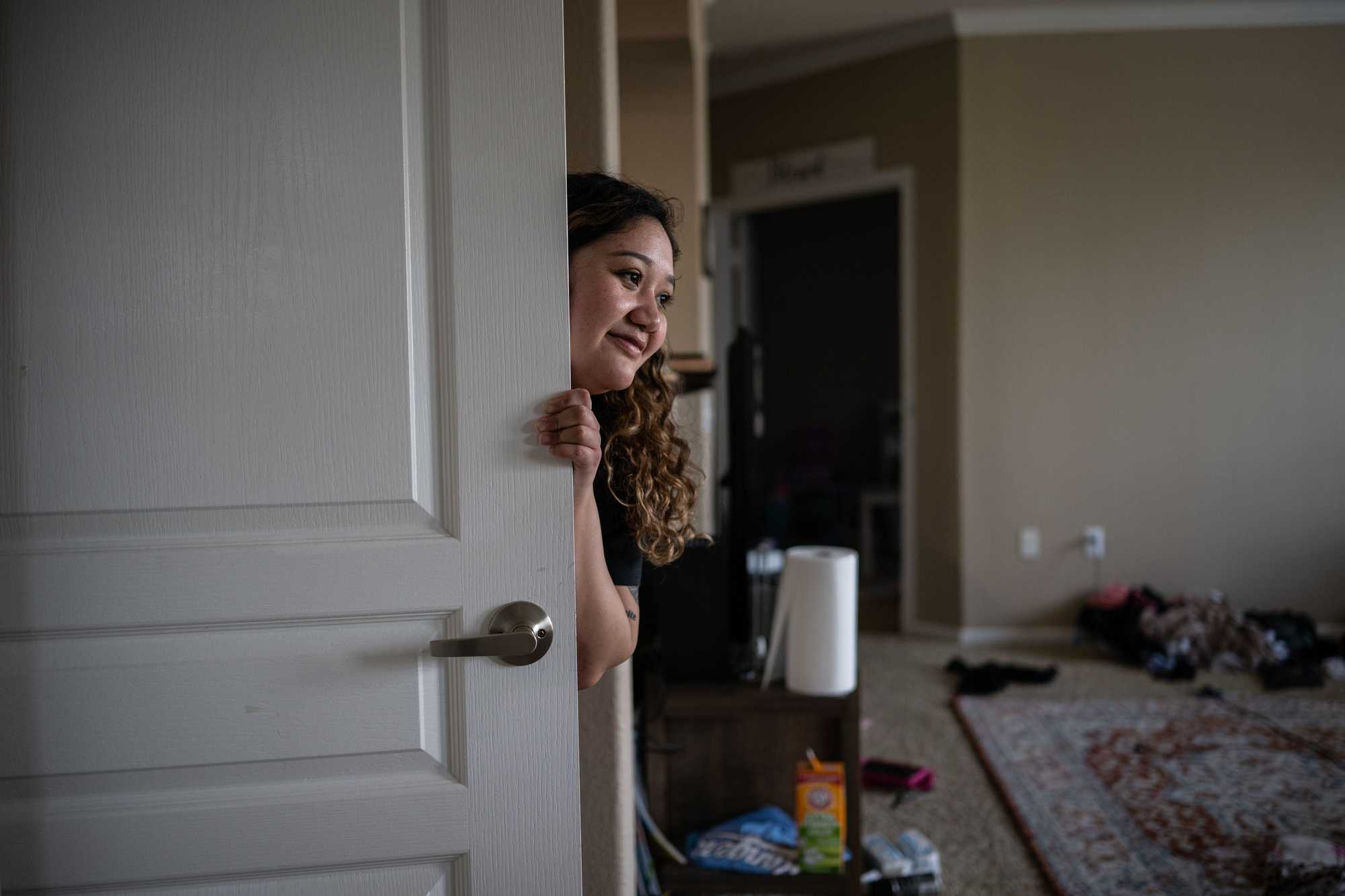 Osuna checked in on her daughters at their apartment. "Having more time for your kids and not feeling so much stress means you can be a better parent,” Osuna said. “You can be more aware of what’s going on with your child.” (Tamir Kalifa for The Boston Globe)